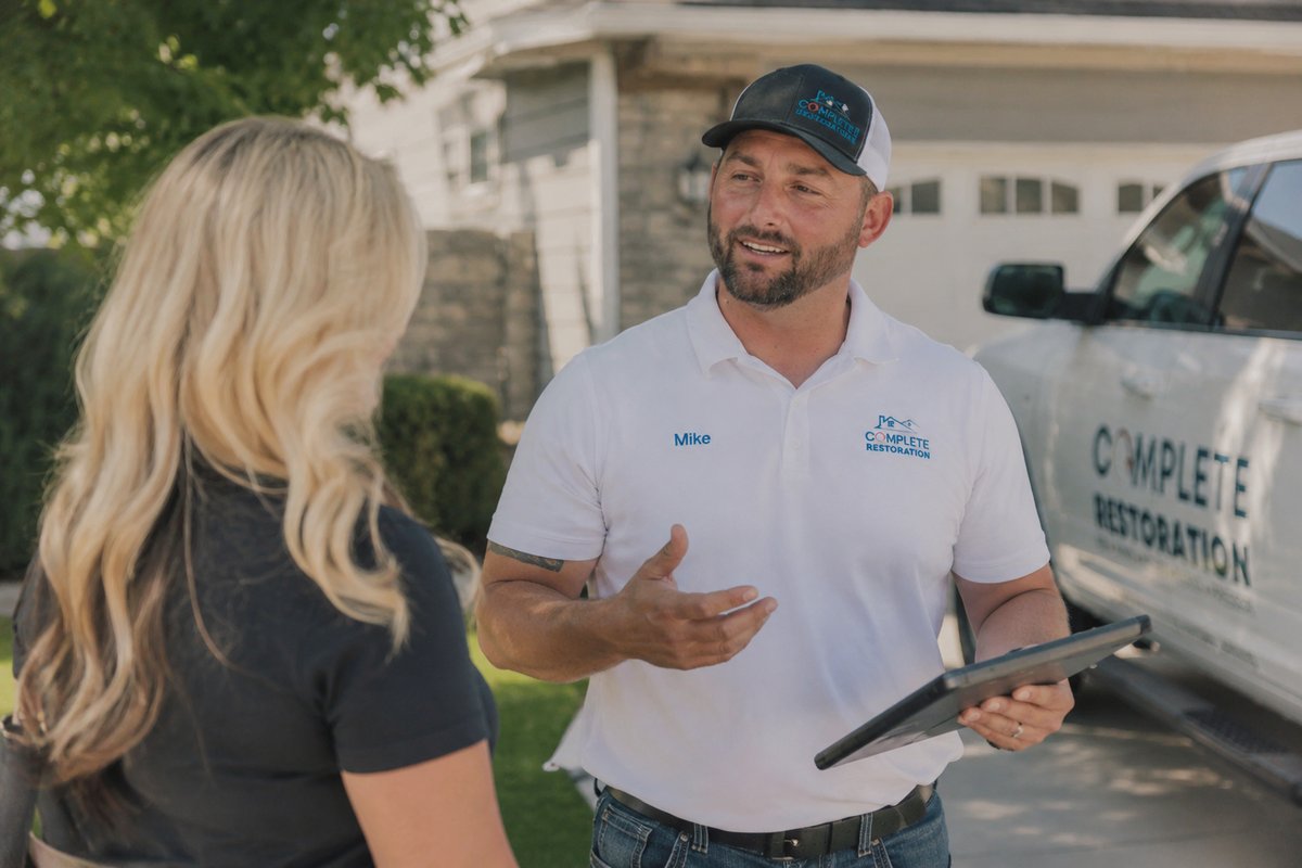 Mike Cummings consulting with a homeowner