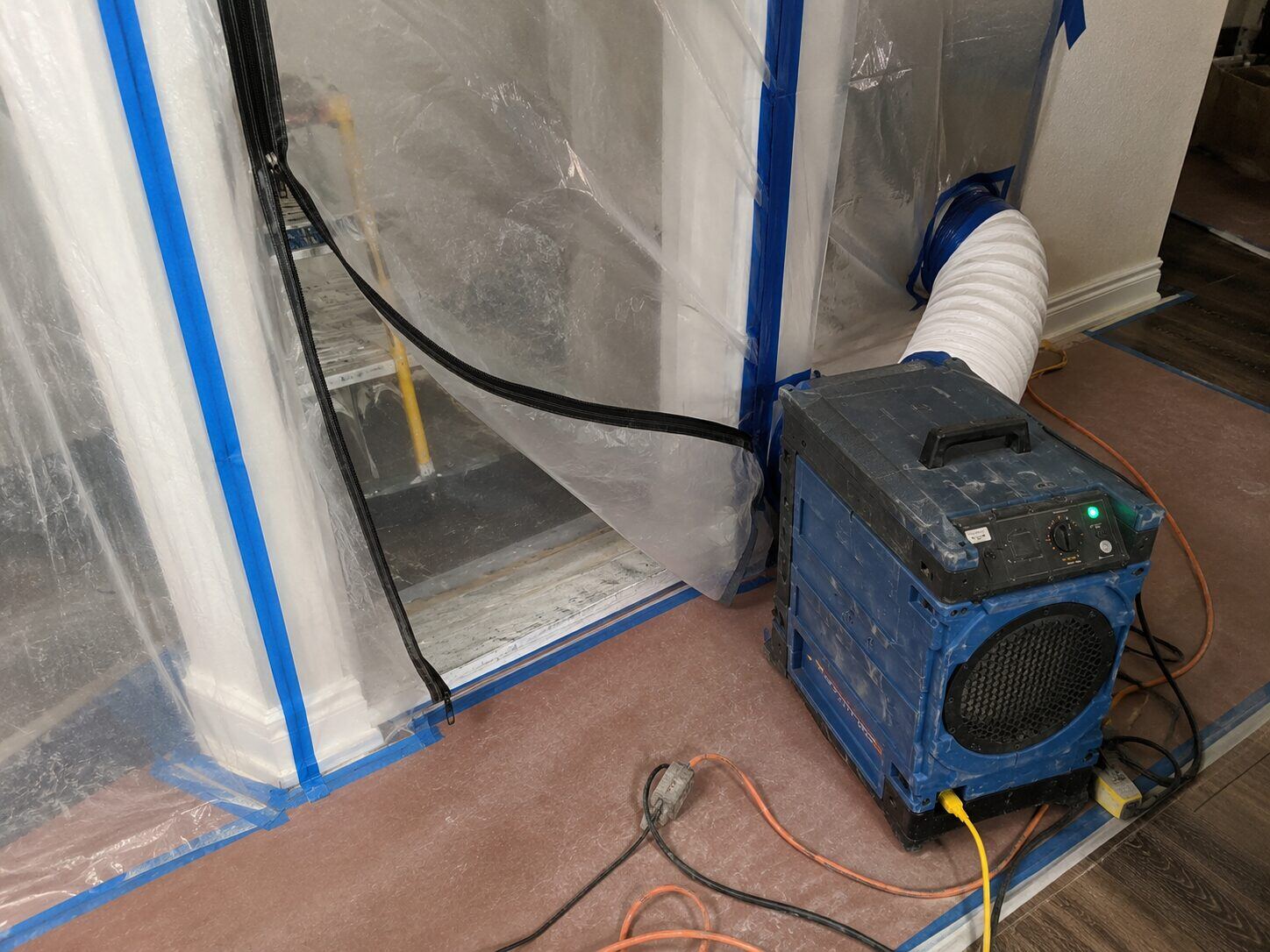 Air scrubber and containment barrier set up for a mold remediation job