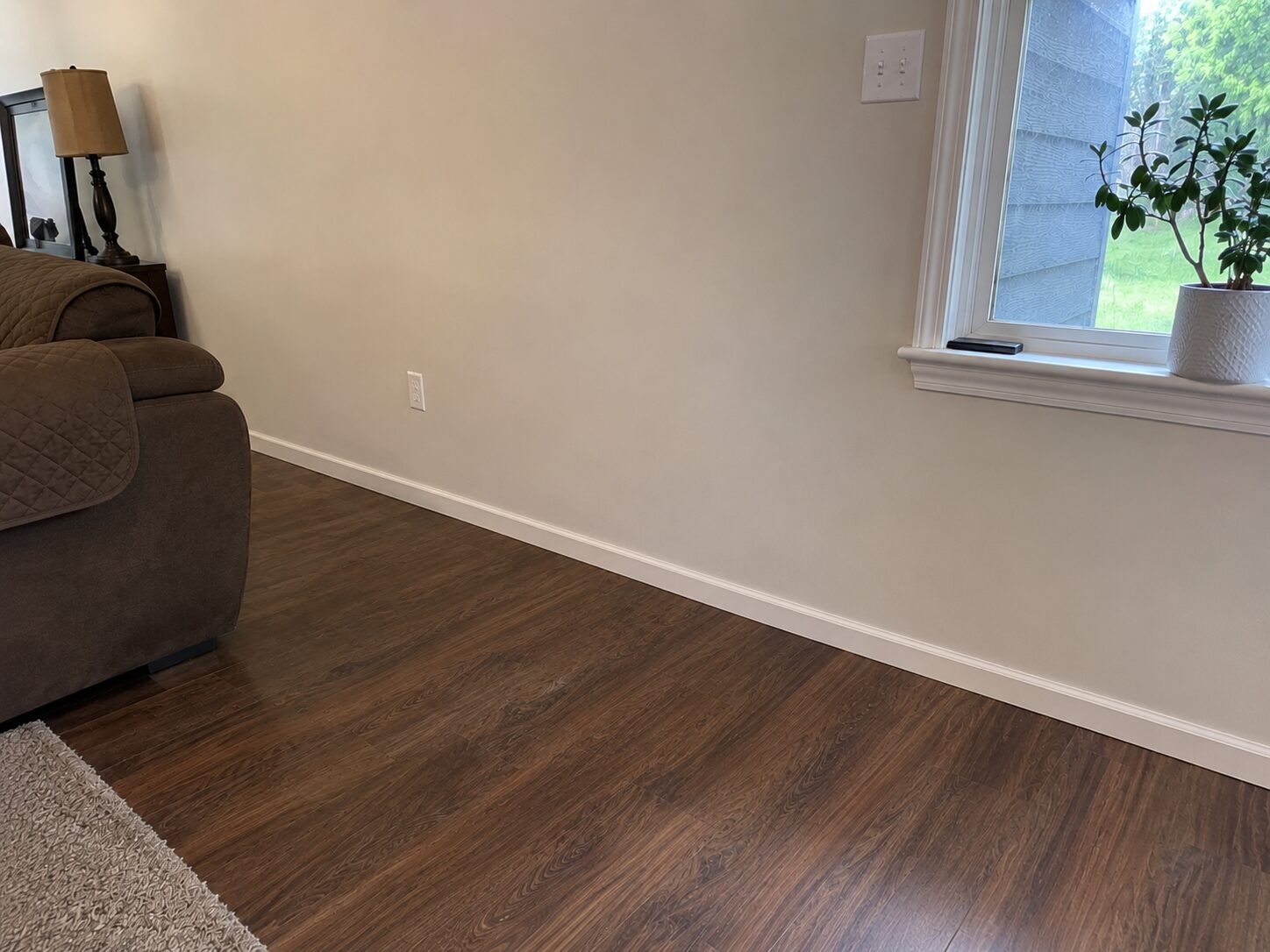 Same wall after water damage restoration, fully repaired with no visible damage